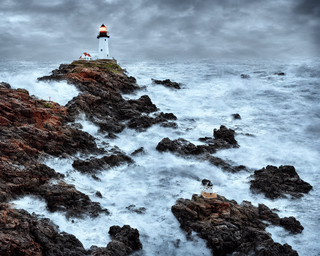 00281-817047232-lighthouse_on_a_rocky_shore_during_a_storm2C_photo_realistic.png